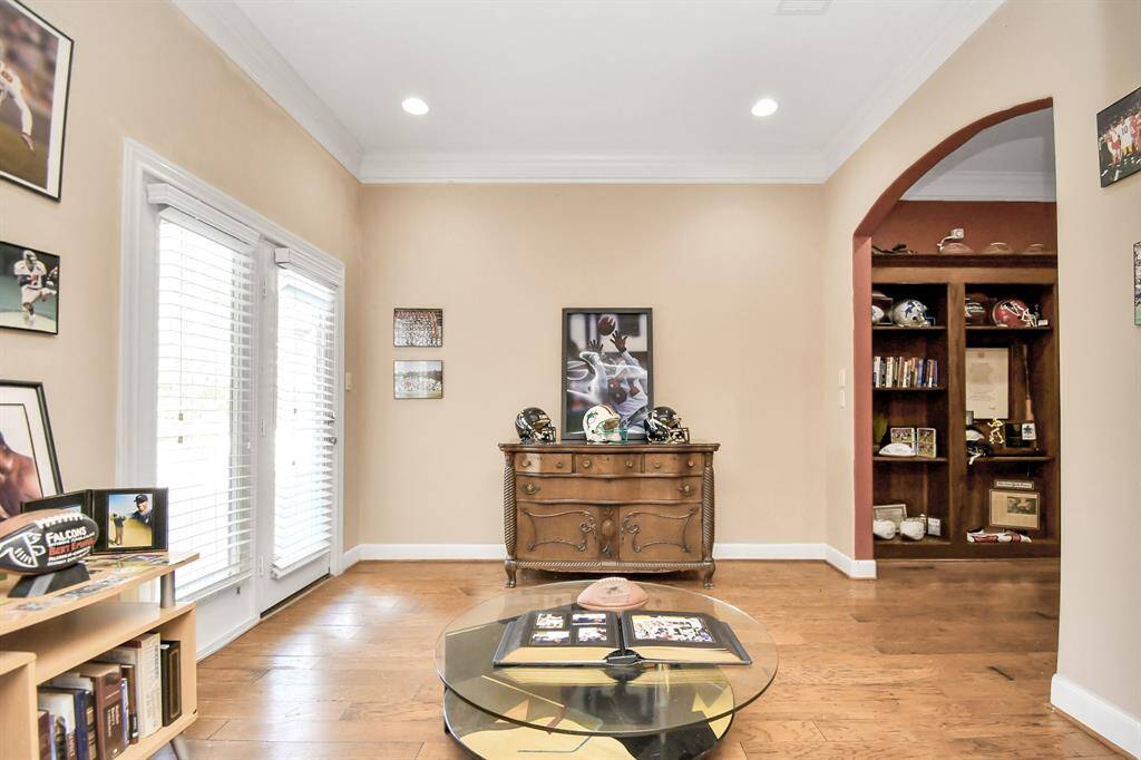 The Mud room features French doors that lead to the formal dining room and a set of double doors that lead to the drive way.