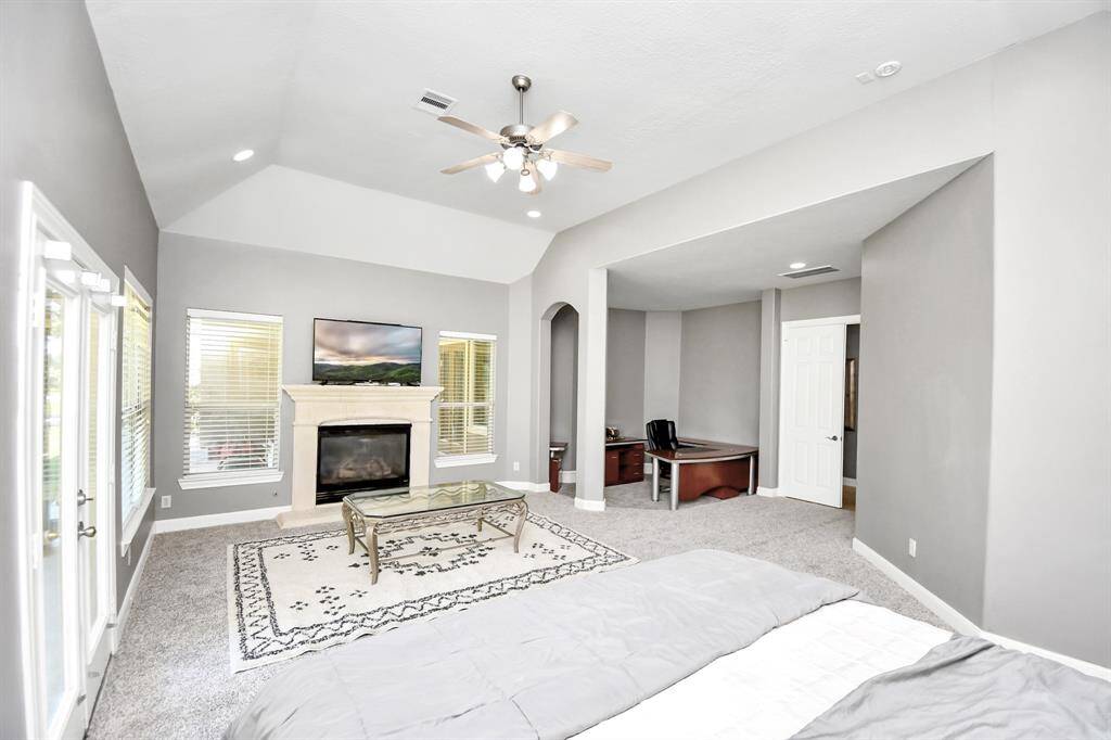 Master Bedroom Downstairs - Cozy gas fireplace and extra-large walk-in closet with aprivate attached laundry room for ultimate convenience.