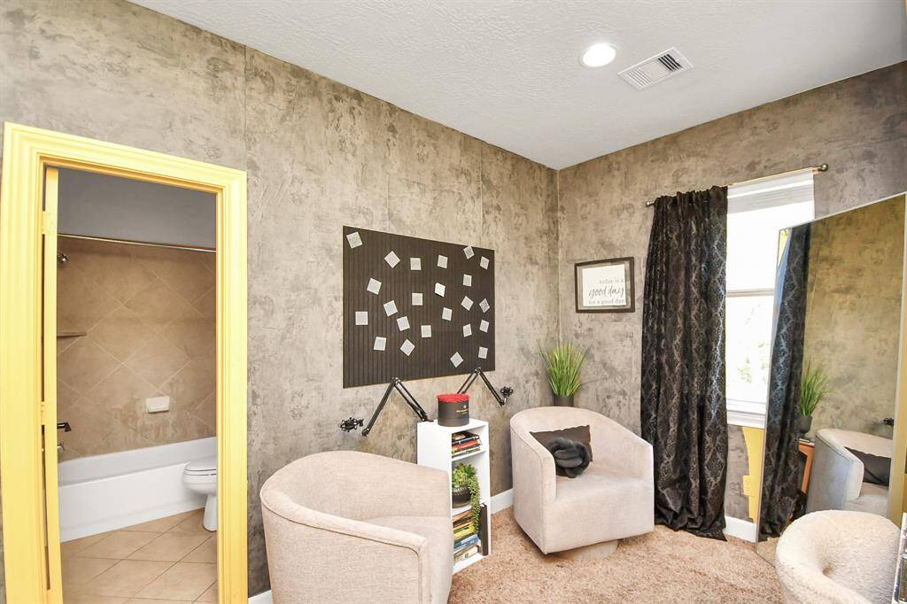 The elevated layout allows for a charming sitting area, podcast studio or private study area, enhancing the room's appeal. Complete with an en suite bathroom, this bedroom offers a true retreat within the home. Additionally, it conveniently connects to the large flex or storage space of bedroom one (purple room), offering extra convenience and accessibility.
