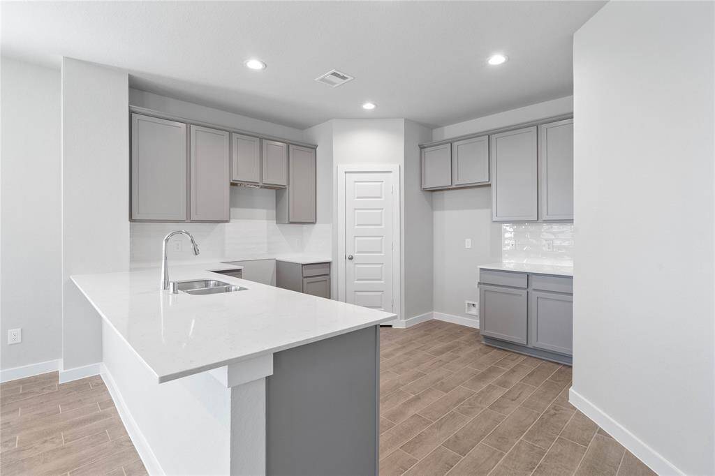 Additional view of this spacious and beautiful kitchen!