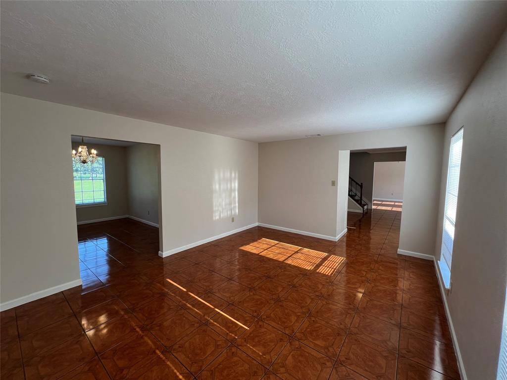 second living room leading to the formal dining room