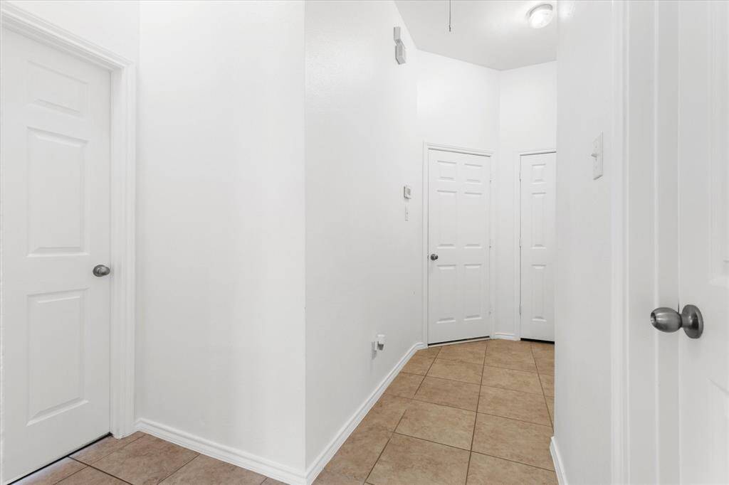 Hallway to secondary bedroom and bathroom bedroom a