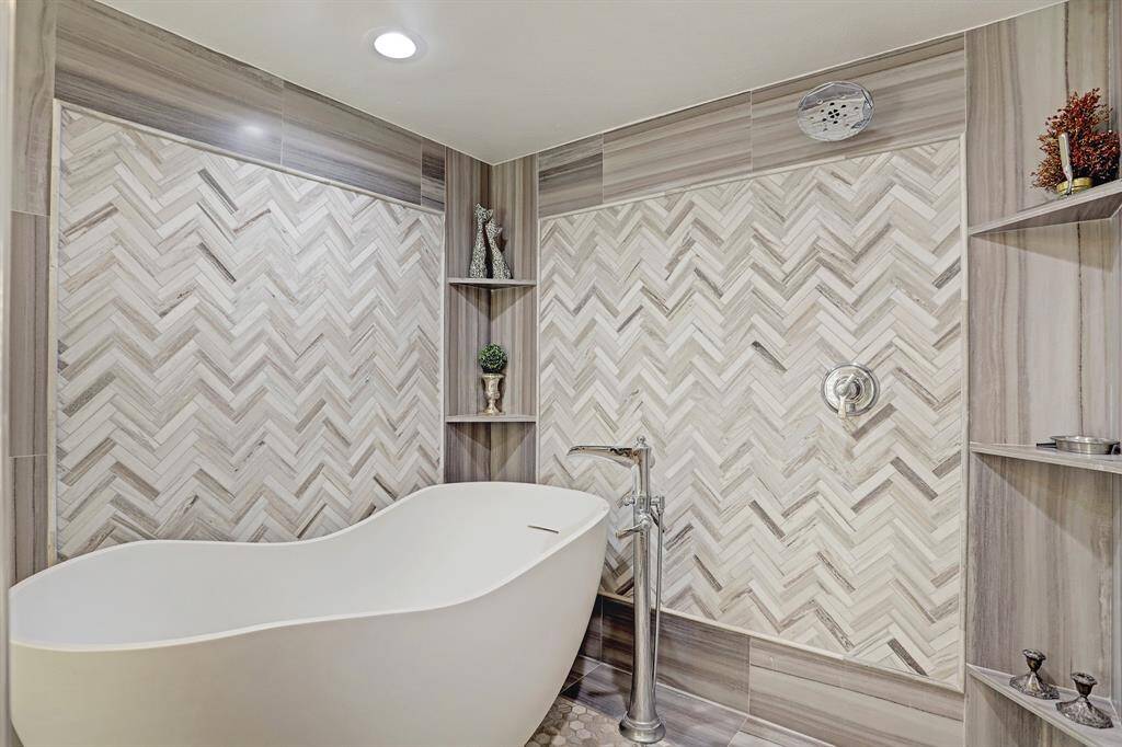 Tub and Shower in the Primary Bathroom.