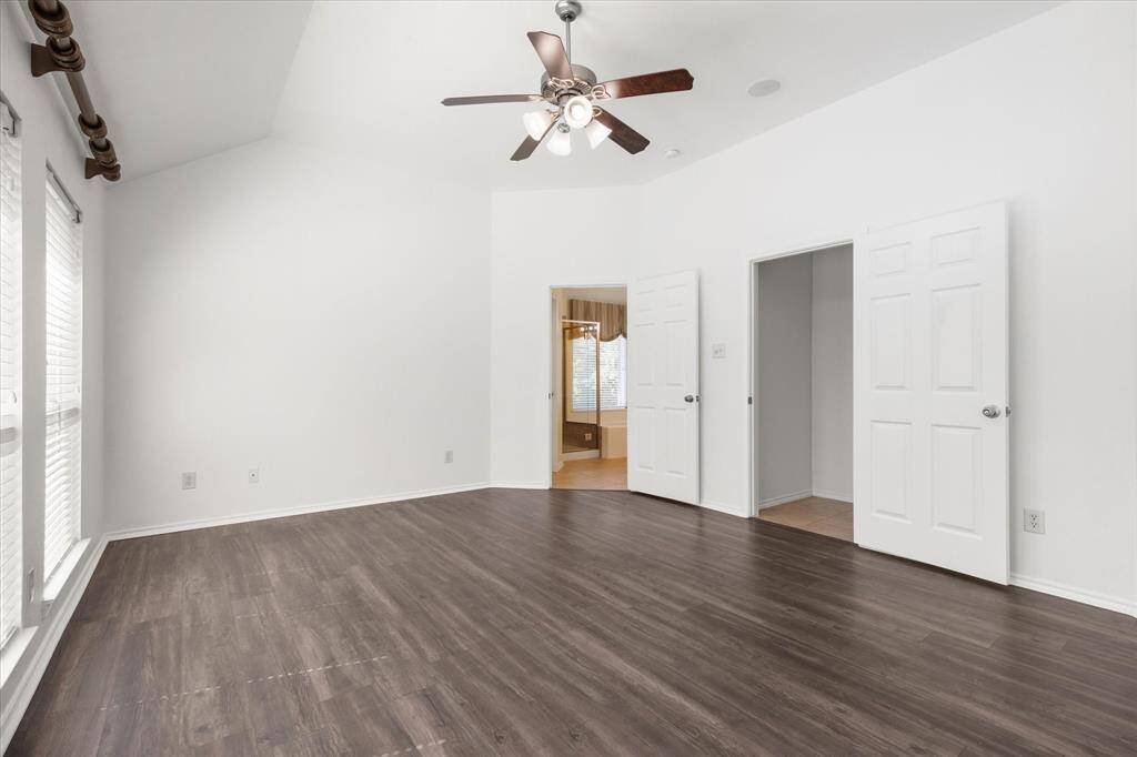 Very spacious primary bedroom with room for siting area.