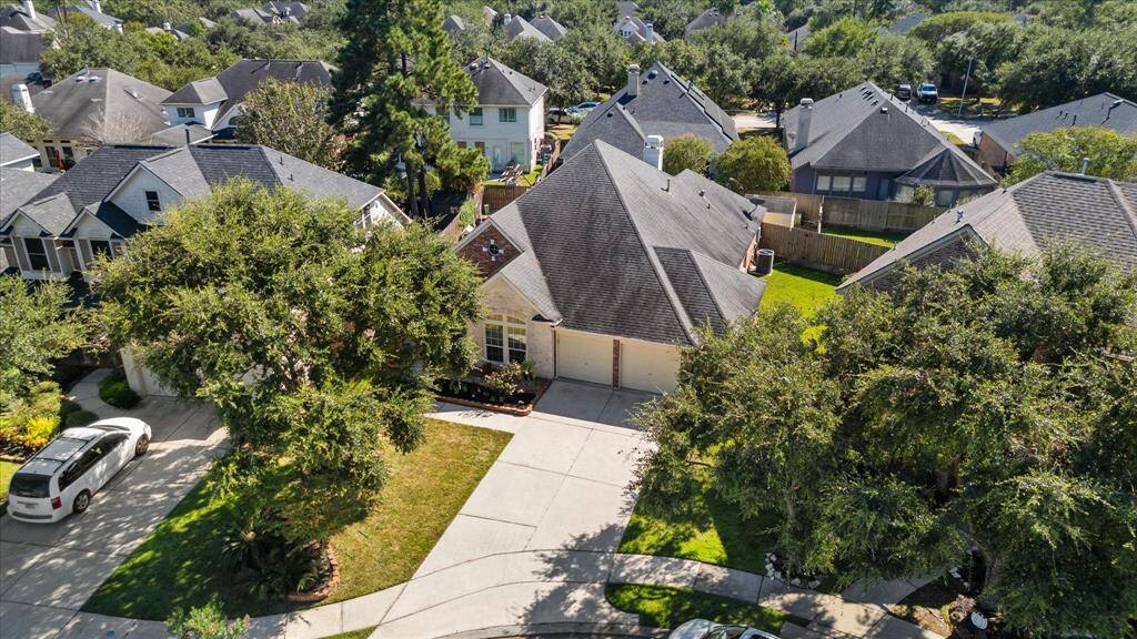 Aerial view of front of house leading up driveway