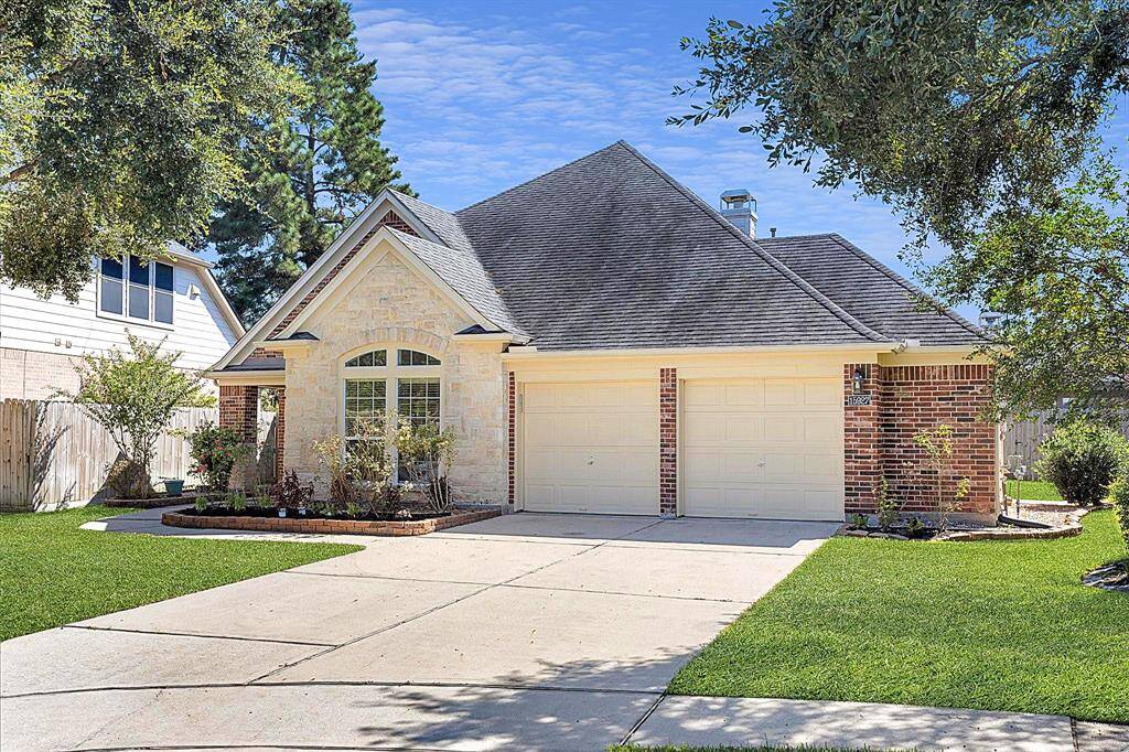 Charming single-story home featuring a stone and brick facade, and an attached two-car garage, nestled in a serene neighborhood.*