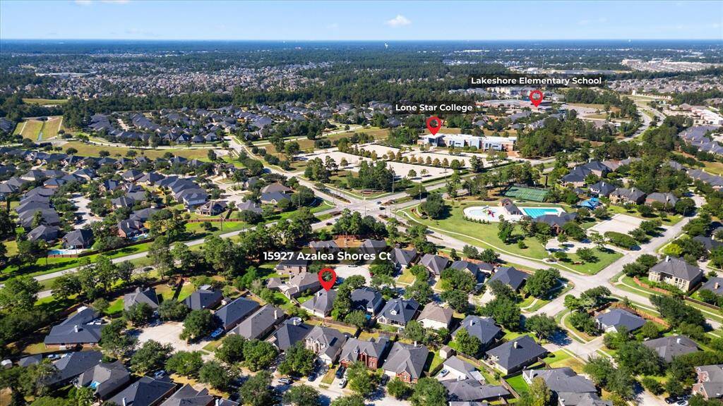 Aerial view of house and surrounding neighborhoods/schools