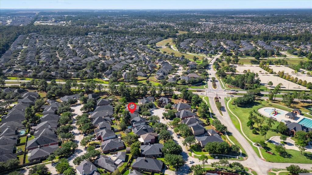 Aerial view of house and entrance to neighborhood