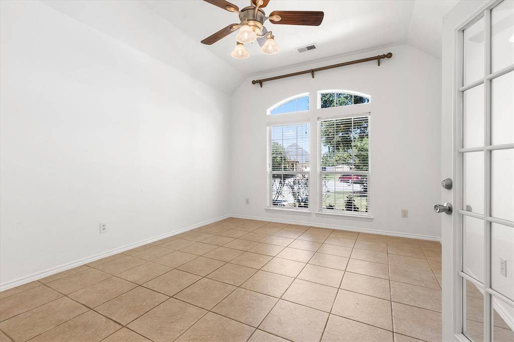 Great for study, office and much more This is a bright, airy room with tiled flooring, a vaulted ceiling with a ceiling fan, and a large window allowing for natural light.
