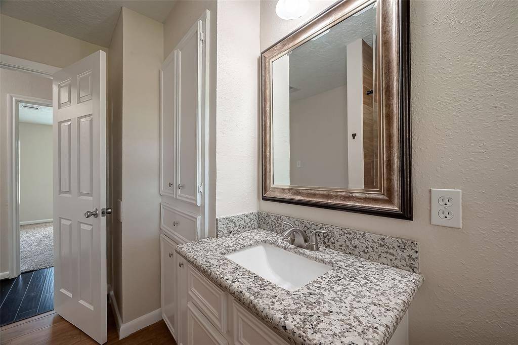 Hall bath with nice built-in cabinets