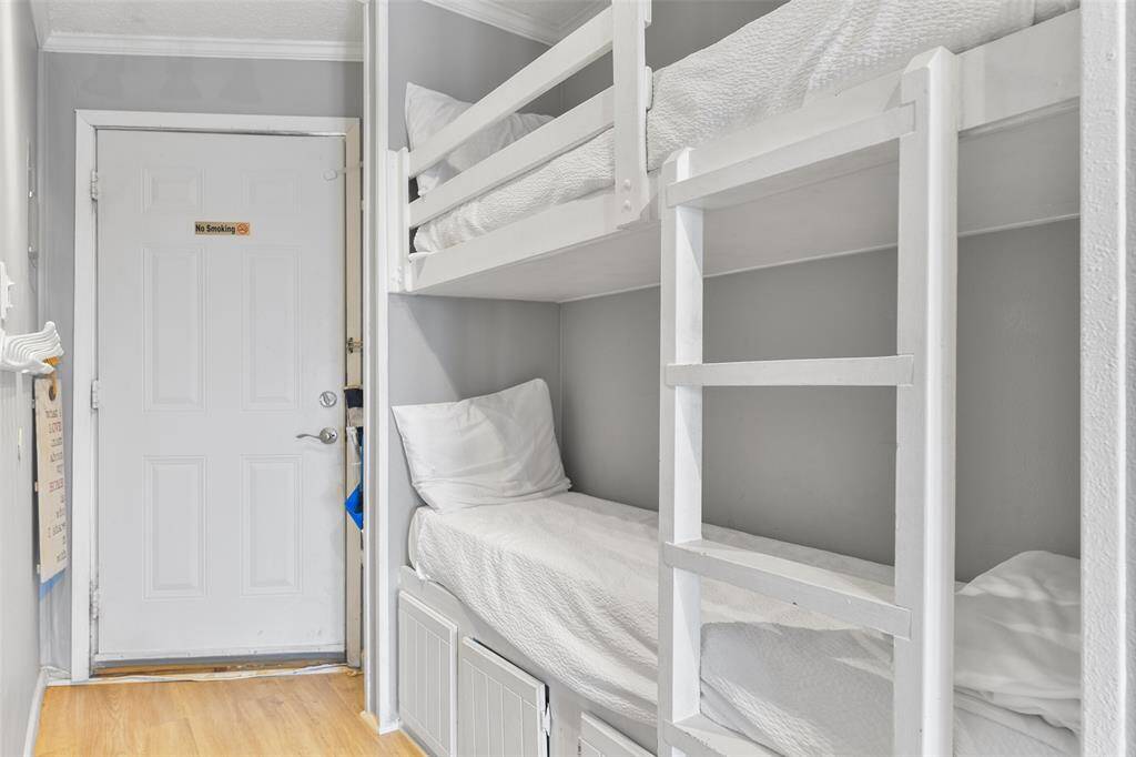 These convenient built-in bunk beds create a cozy and practical space for guests or kids.