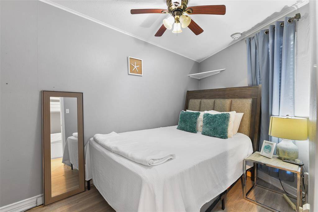 This thoughtfully designed bedroom offers a comfortable retreat, complete with a compact yet efficient closet space to meet your storage needs.