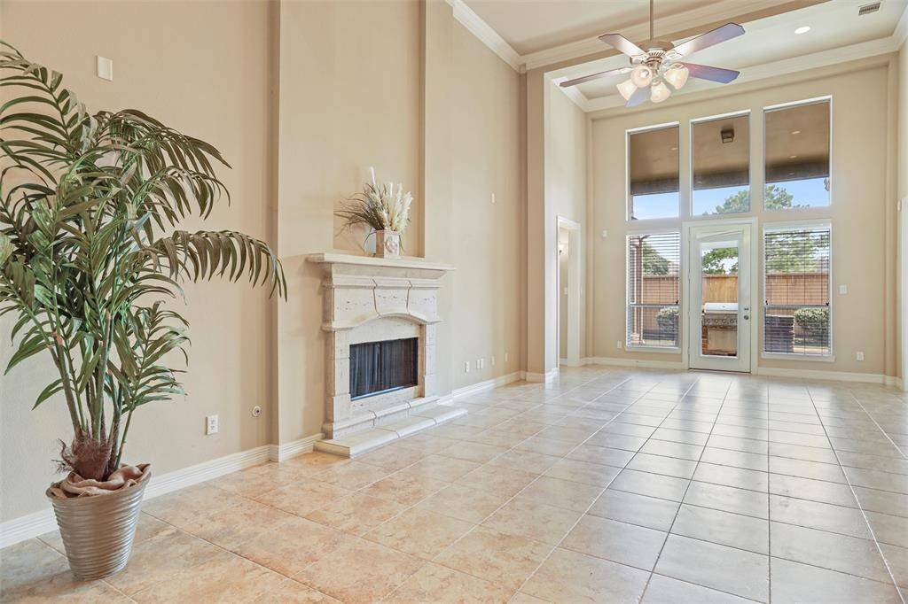 Step directly from your spacious living area onto the inviting back porch, complete with a convenient outdoor kitchen — perfect for entertaining or quiet relaxation.