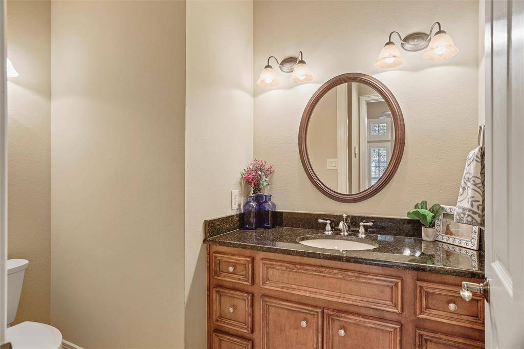Experience seamless convenience with this cleverly designed half-bath that adjoins the full bathroom, offering a versatile Jack-and-Jill style layout.