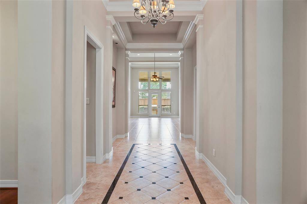 Step into elegance with a stunning, light-filled entryway that beckons you home.