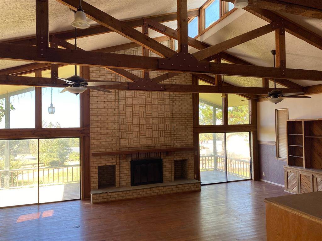 Huge living room with tons of natural lighting and cabinet space