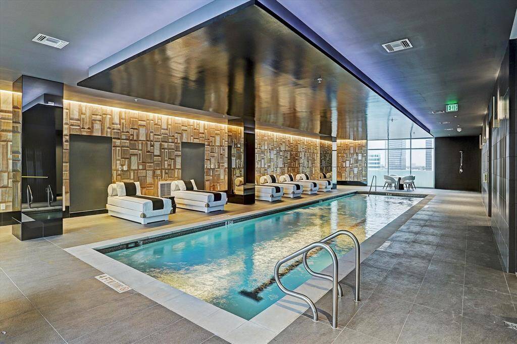 Experience year-round relaxation in this elegant indoor pool, featuring sleek design and luxurious lounging areas.