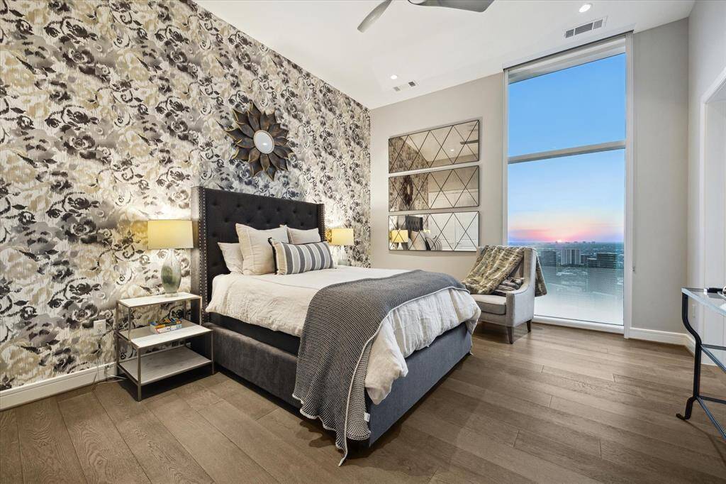 Another Chic guest room featuring a stunning feature wall and panoramic sunset views.