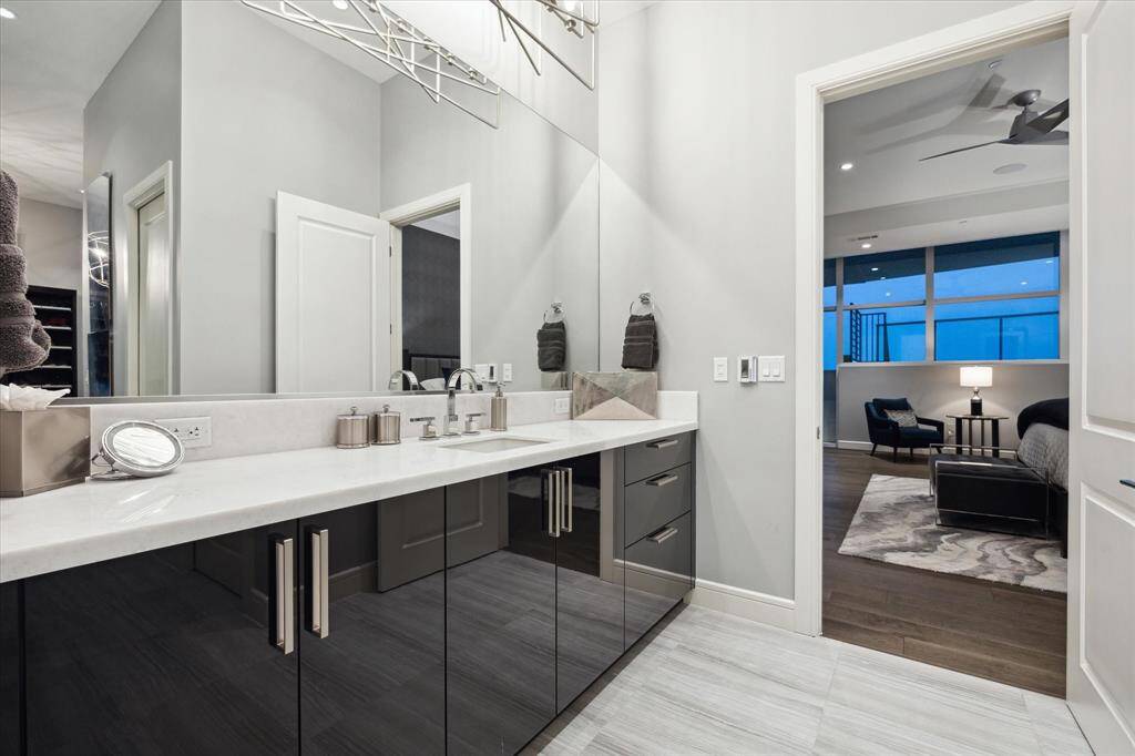Indulge in the serenity of your luxurious primary bathroom, featuring a sleek double vanity for ultimate comfort and convenience.
