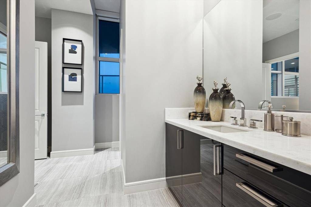 Relax in this Elegant en-suite bathroom with sleek modern finishes and abundant natural light.