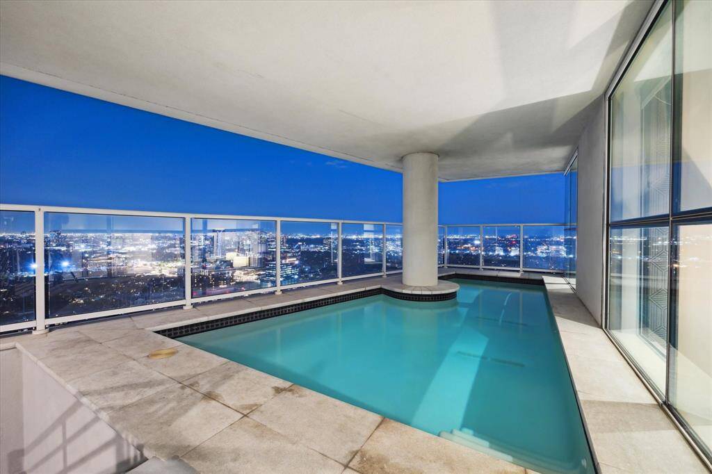 Private rooftop pool with panoramic city views perfect to relax and enjoy after a long day.