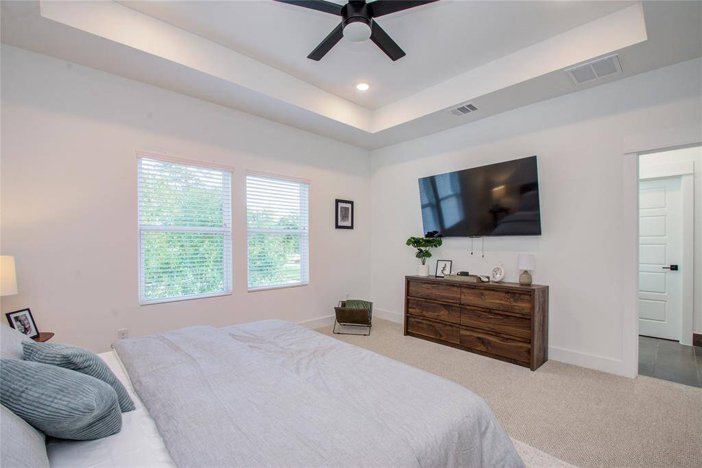 Another view of the spacious Primary Bedroom. Model home photos, finishes and floor plan MAY VARY! Ceiling fans are NOT INCLUDED!