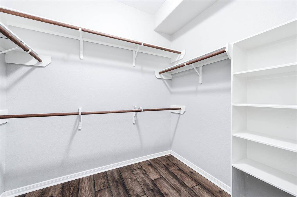 Primary walk-in closet.