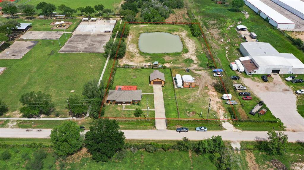 Charming 4-bedroom home with a detached two-car garage, all set on a spacious 2.39-acre lot.