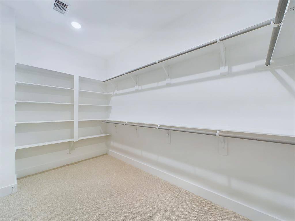 Large Walk-In Closet in Primary Bedroom. Model home photos, finishes and floor plan MAY VARY!