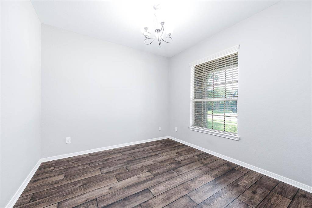 Room off the front of the home can be used as a formal dining or an office space.