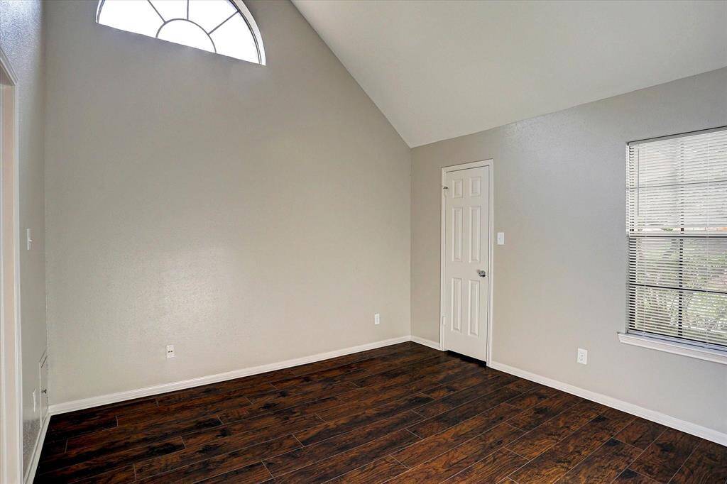 Primary bedroom with beautiful vaulted ceiling