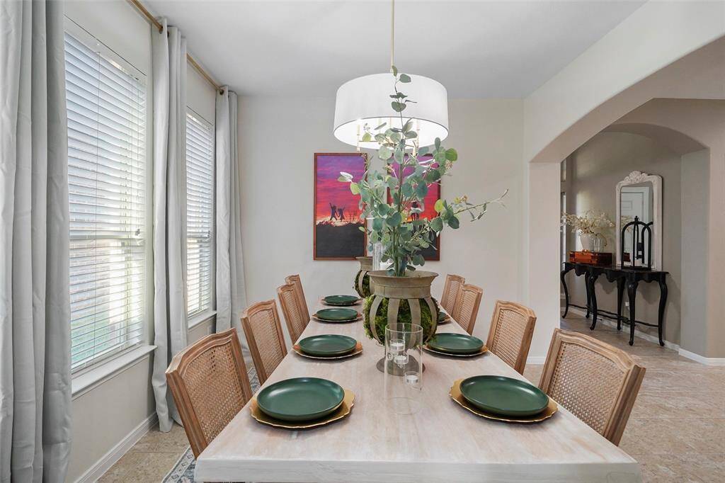 Updated drum light fixture and neutral wall paint makes this room ready for your furniture.
