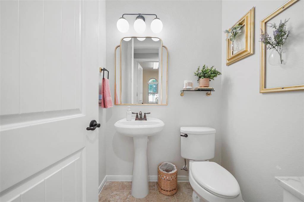 First floor powder room is convenient for guests.