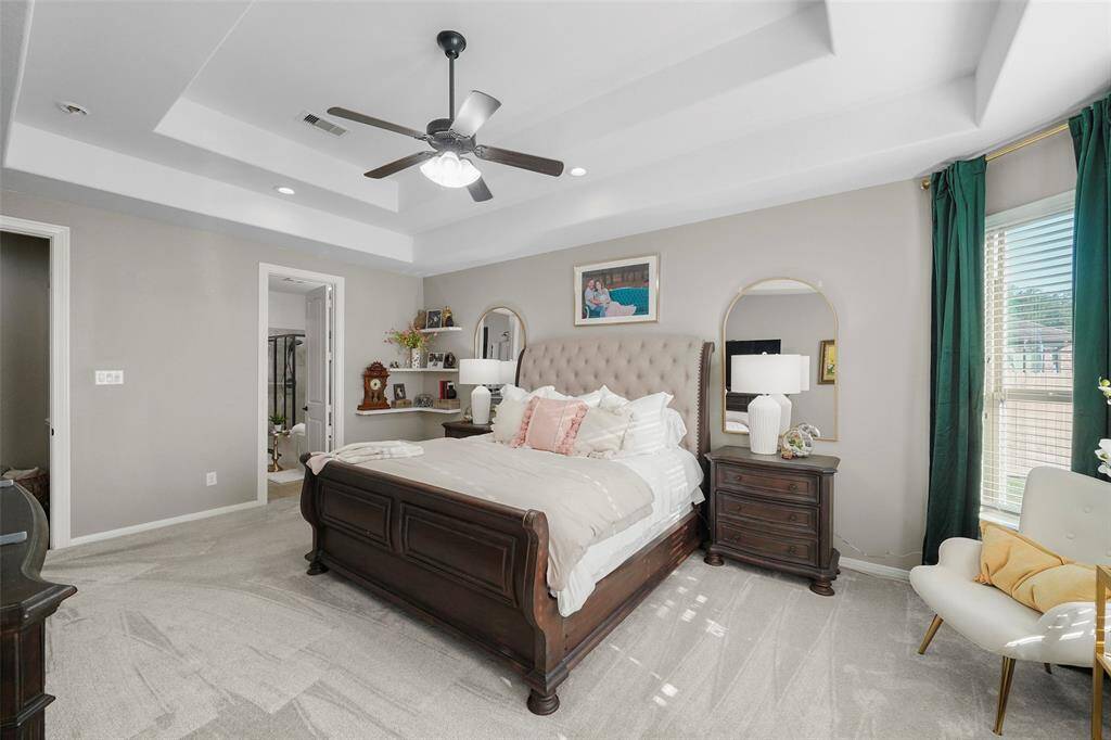 An ensuite primary bath is just beyond in this photo.