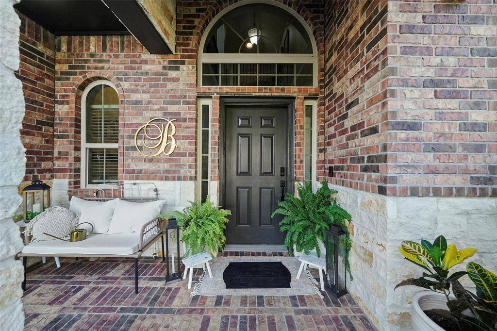 Lovely front porch for relaxing and welcoming guests.