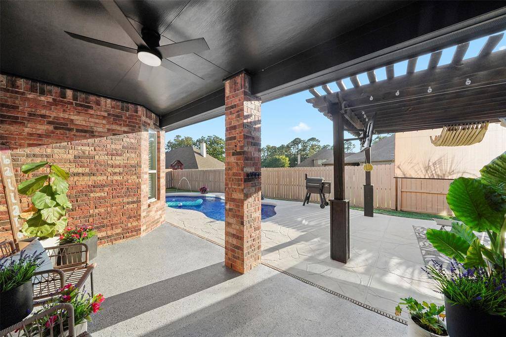 Back porch is a great covered space to even enjoy the space on a rainy day.