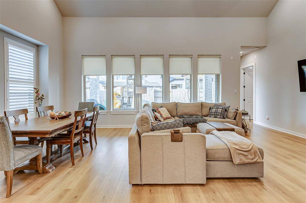 This grand living space with vaulted catherdral ceilings, French Oak wood floors is the perfect space to host large gatherings.