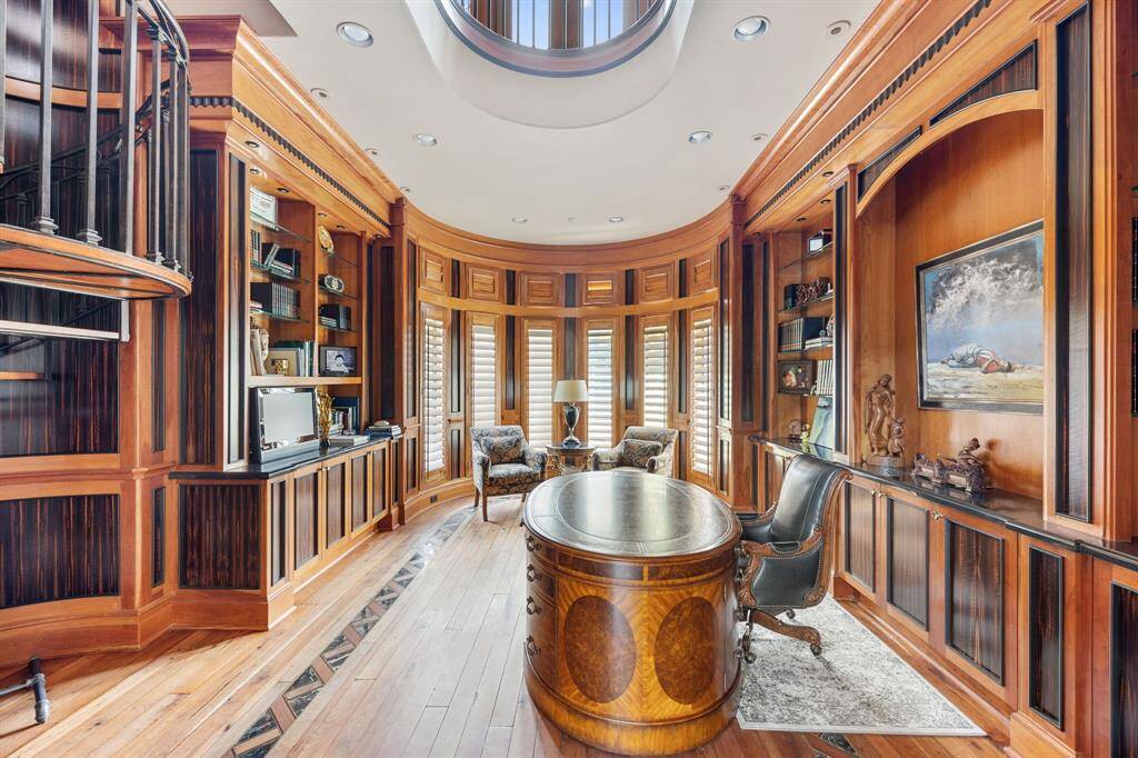 [Great Room] Two-and-one-half stories overhead is a handsome coffered ceiling; within the coffers are inlays of brick and plaster.