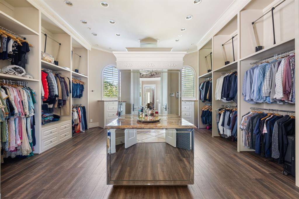 [Master Bathroom] The Master Bathing Spa features an oversized walk-in Shower with dual shower heads and shower wand, a private Water Closet, dual Vanities and sinks, plus another series of leaded glass windows that afford privacy and light in the same space.