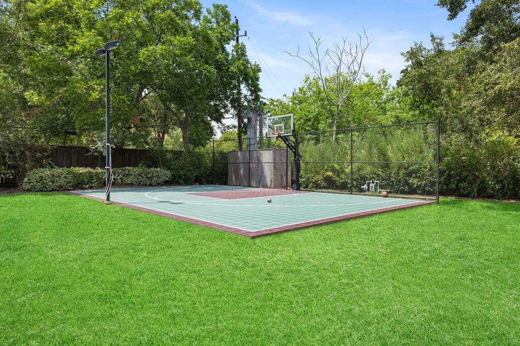 [Sports Court] The illuminated Sports Court is tucked away on the northwest corner of the Estate. Practice your Golf or Tennis swing, smack the Tetherball around the pole, put together a pick up game of Basketball, or be all the rage and convert the Sports Court to a Pickleball Court!