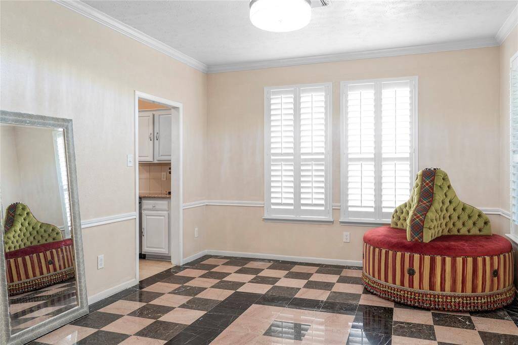 A versatile room downstairs can serve as either an office or a formal dining room.