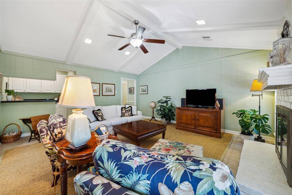 Fabulous living space with vaulted ceilings, wet bar and fireplace to suit all seasons