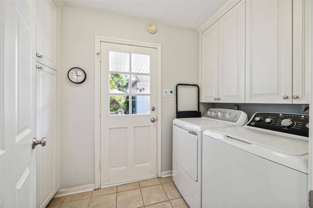 Laundry room with plenty of storage. There are a number of storage closets throughout this home