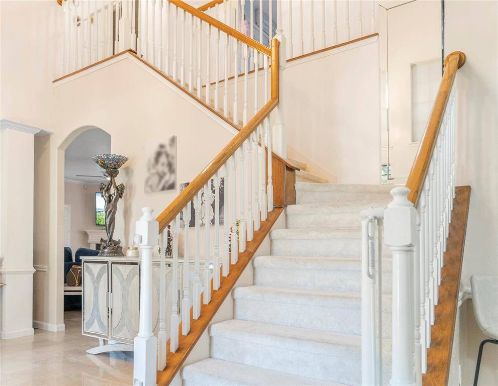 Wooden staircase leading to the second floor.