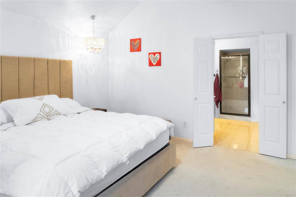 Master bedroom leading to primary bath.