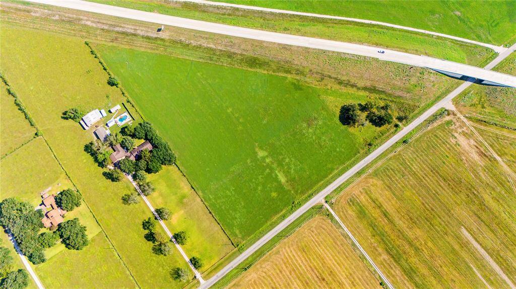 THIS BRIGHT GREEN TRIANGLE ALONG CR 602 & HWY 99