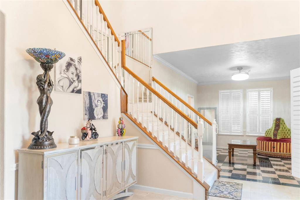 A high entryway that creates a welcoming atmosphere as you enter the home.