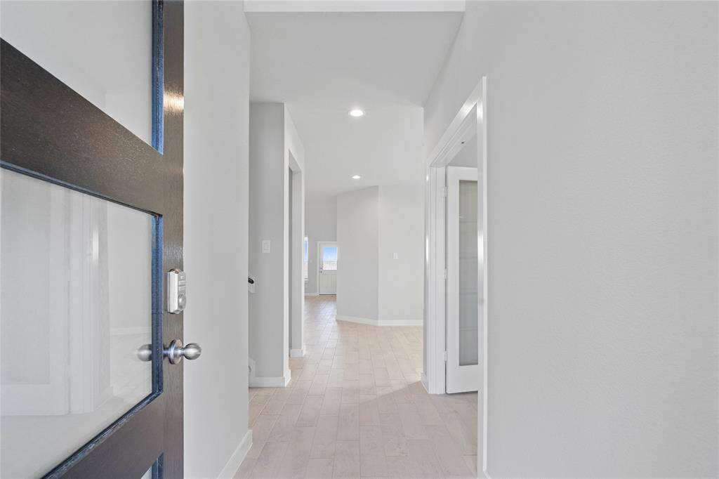 Welcome inside 300 East Tranquil Fields. The entryway is bright with recessed lighting and beautiful tile wood-look flooring!