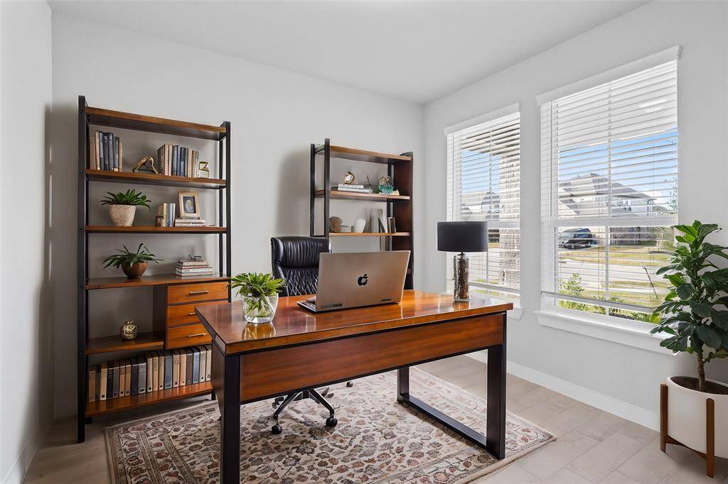 Nestled away quietly in the front of the home is the handsome and grand home office. Featuring neutral paint, beautiful tile flooring and large windows with privacy blinds!