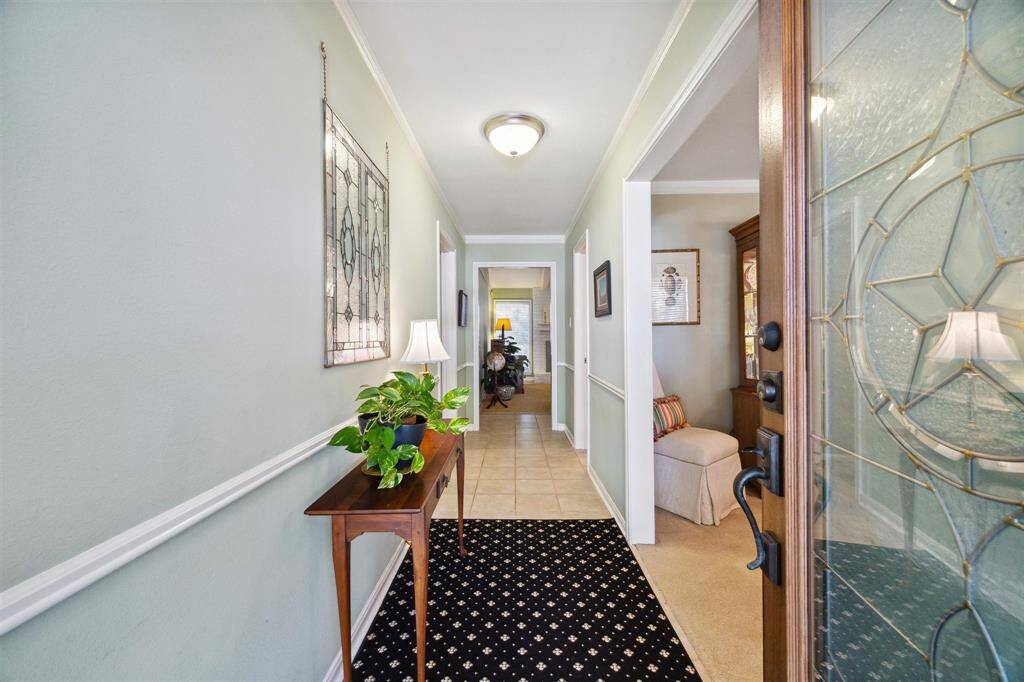 This elegant home boasts beautiful details and a warm and inviting entrance